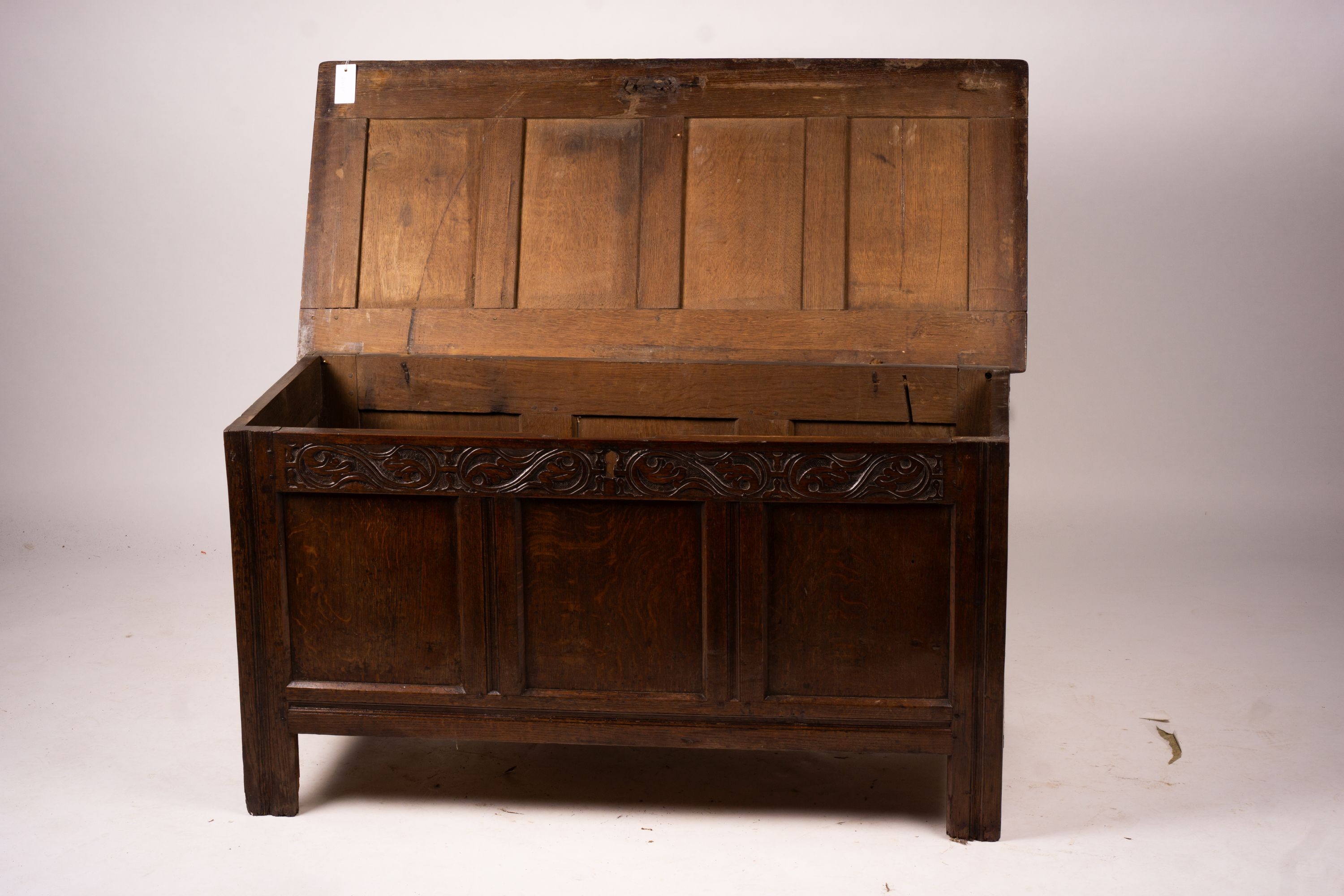 A 17th century panelled oak coffer, W.122cm D.55cm H.65cm